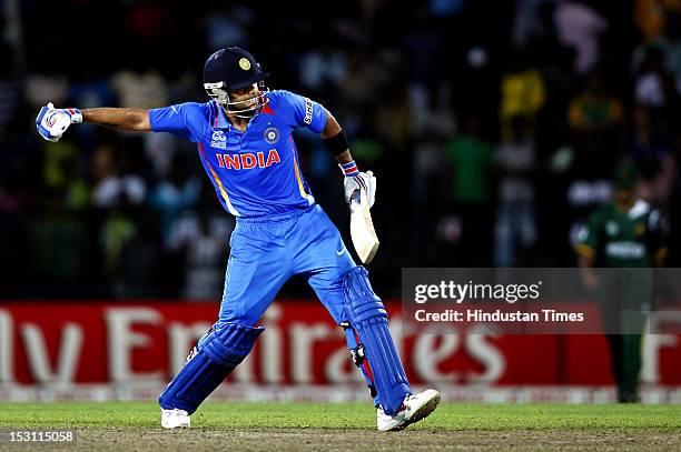 Indian batsman Virat Kohli celebrates after India won the match against Pakistan during the ICC T20 World Cup, Super Eight group 2 cricket match...