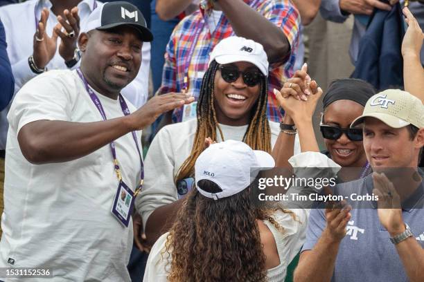 Coco Gauff of the United States with parents Candi Gauff and Corey Gauff celebrate the victory of Christopher Eubanks of the United States after his...