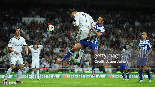 Cristiano Ronaldo of Real Madrid scores past Carlos Marchena of Deportivo La Coruna during the la Liga match between Real Madrid CF and RC Deportivo...