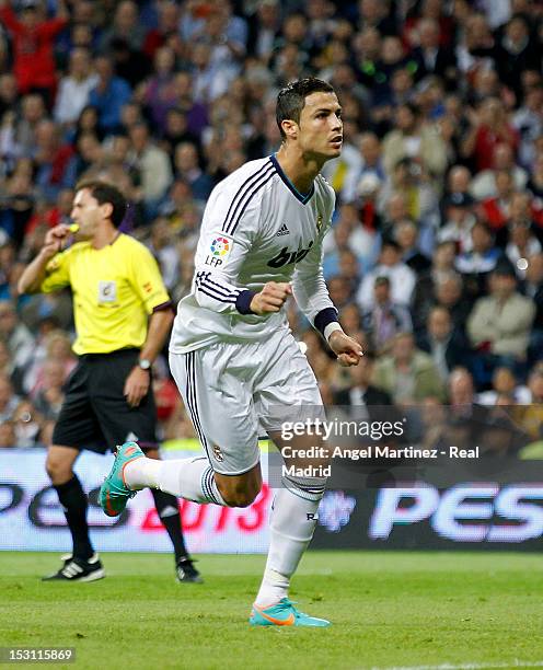 Cristiano Ronaldo of Real Madrid celebrates scoring the opening goal during the La Liga match between Real Madrid and Deportivo La Coruna at Santiago...