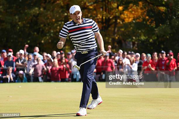 Keegan Bradley of the USA celebrates a putt during the Singles Matches for The 39th Ryder Cup at Medinah Country Club on September 30, 2012 in...