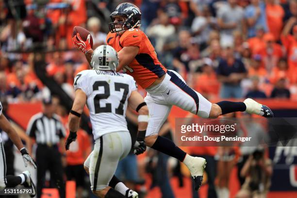Tight end Joel Dreessen of the Denver Broncos catches a 22 yard touchdown pass form quarterback Peyton Manning of the Denver Broncos against free...