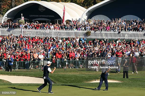 Justin Rose of Europe celebrates a birdie putt on the 18th green to defeat Phil Mickelson 1up during the Singles Matches for The 39th Ryder Cup at...