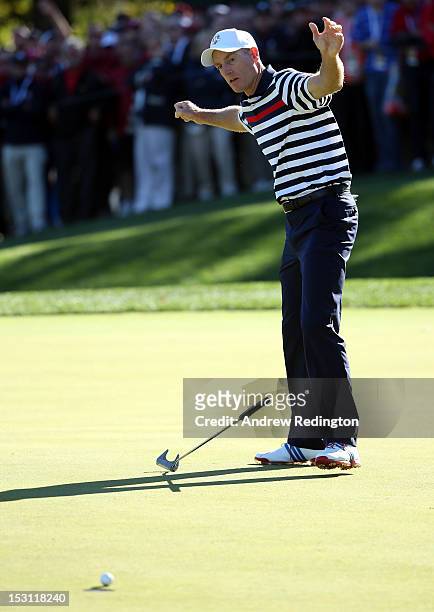 Jim Furyk of the USA reacts to a missed putt on the 16th green during the Singles Matches for The 39th Ryder Cup at Medinah Country Club on September...