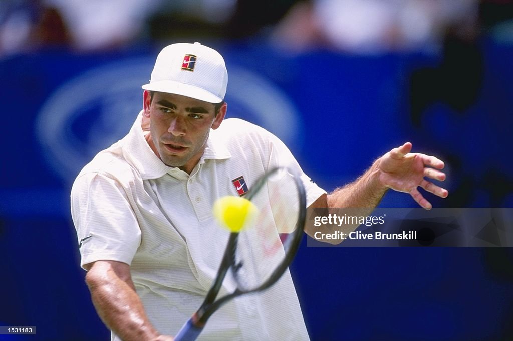 Pete Sampras of the USA in action against Dinu Pescariu of Romania