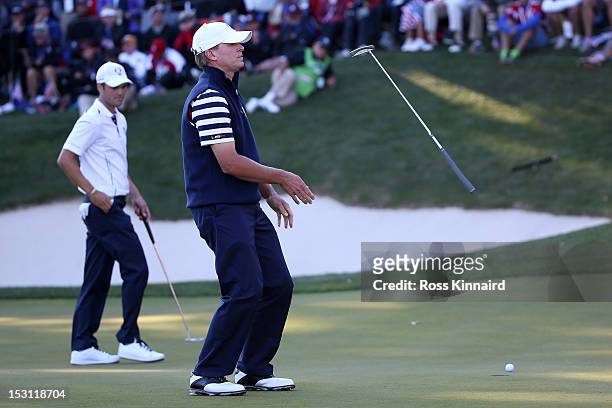 Steve Stricker of the USA reacts to a missed par putt on the 17th green as Martin Kaymer of Europe looks on during the Singles Matches for The 39th...