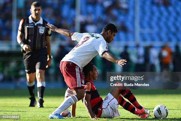 September 30: Gum of Fluminense struggles for the ball with Liedson of Flamengo during a match as part of Serie A 2012 at Engenhao stadium on...