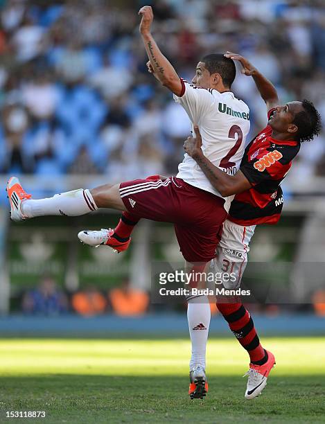 Bruno of Fluminense struggles for the ball with Liedson of Flamengo during a match as part of Serie A 2012 at Engenhao stadium on September 30, 2012...