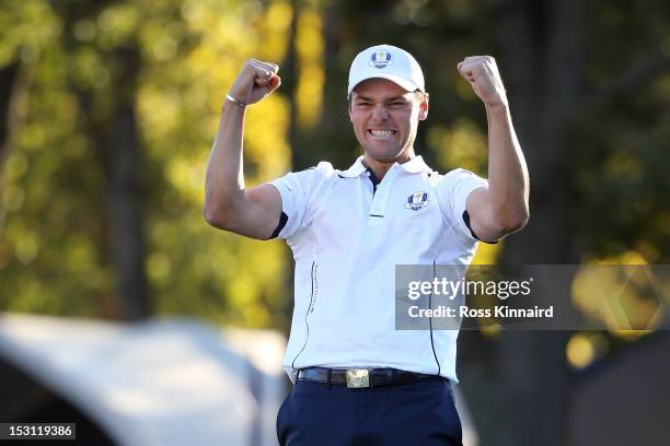 Martin Kaymer of Europe celebrates after making the winning putt on the 18th green to win The 39th Ryder Cup at Medinah Country Club on September 30,...