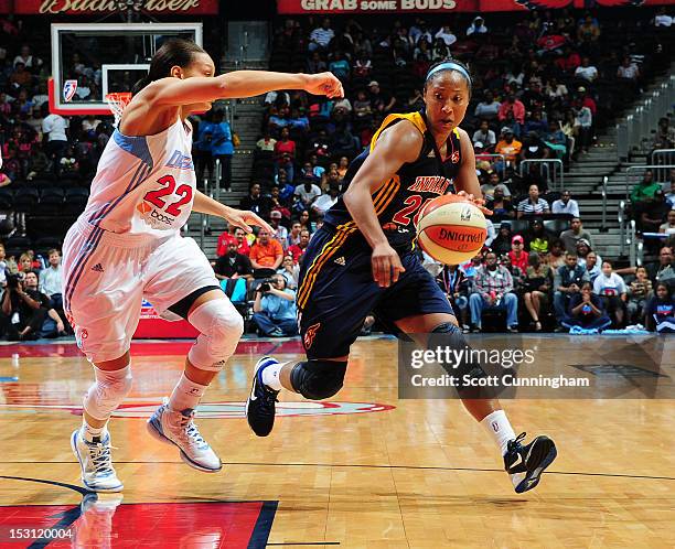 Briann January of the Indiana Fever drives against Armintie Price of the Atlanta Dream during Game 2 of the Eastern Conference Semi-Finals at Philips...