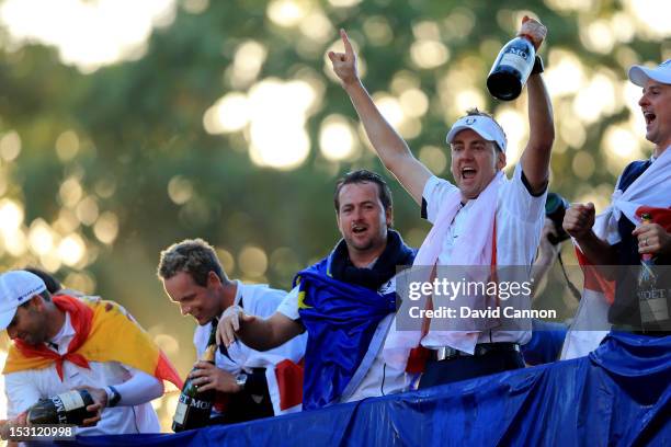 Sergio Garcia, Luke Donald, Graeme McDowell and Ian Poulter of Europe celebrate after winning The 39th Ryder Cup at Medinah Country Club on September...