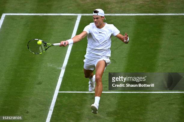 Holger Rune of Denmark plays a forehand against Grigor Dimitrov of Bulgaria in the Men's Singles fourth round match during day eight of The...