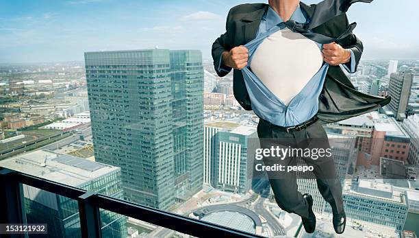 superhero pulling open shirt in mid air - superhero flying stock pictures, royalty-free photos & images