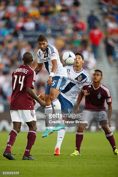 Sean Franklin of Los Angeles Galaxy heads the ball away from Omar Cummings of Colorado Rapids during their MLS match at Dick's Sporting Goods Park...