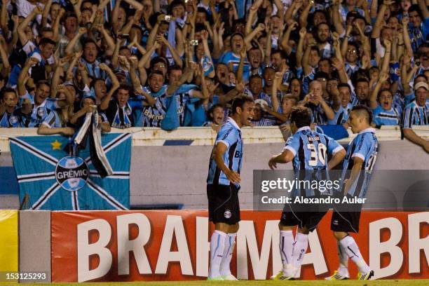 Werley, Marcelo Moreno and Kleber celebrate a goal during the match between Gremio and Santos as part of the brazilian championship at Olimpico...