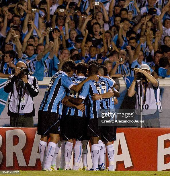 Werley, Marcelo Moreno and Kleber celebrate a goal during the match between Gremio and Santos as part of the brazilian championship at Olimpico...