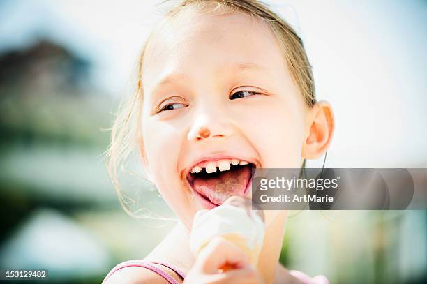 little girl eating ice-cream - girls licking girls stock pictures, royalty-free photos & images