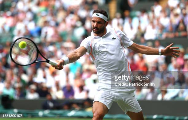 Grigor Dimitrov of Bulgaria plays a backhand against Holger Rune of Denmark in the Men's Singles fourth round match during day eight of The...