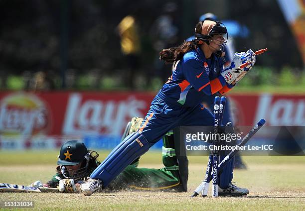 Wicketkeeper Sulakshana Naik of India just misses out on running out Nain Abidi of Pakistan during the ICC Women's World Twenty20 2012 Group A match...