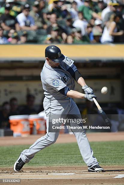 Casper Wells of the Seattle Mariners bats against the Oakland Athletics at O.co Coliseum on September 30, 2012 in Oakland, California. The Athletics...