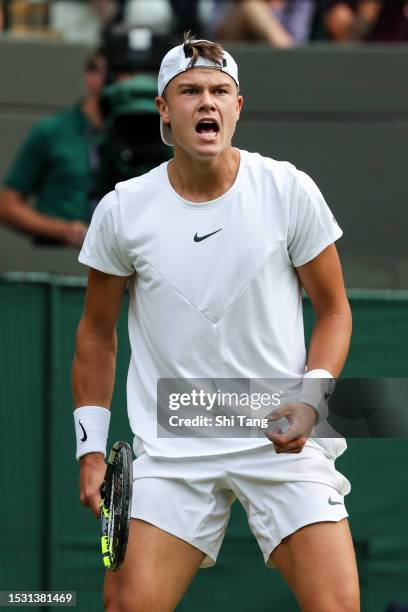 Holger Rune of Denmark reacts in the Men's Singles fourth round match against Grigor Dimitrov of Bulgaria during day eight of The Championships...