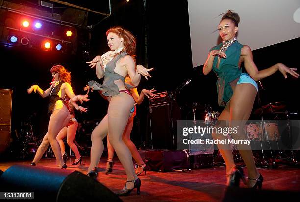 The burlesque group "Harlow Gold" performs on stage during the 10th Annual GLAD Benefit in support of equal access for the deaf and hard of hearing...