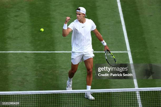 Holger Rune of Denmark celebrates against Grigor Dimitrov of Bulgaria in the Men's Singles fourth round match during day eight of The Championships...