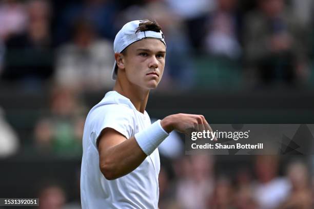 Holger Rune of Denmark reacts against Grigor Dimitrov of Bulgaria in the Men's Singles fourth round match during day eight of The Championships...