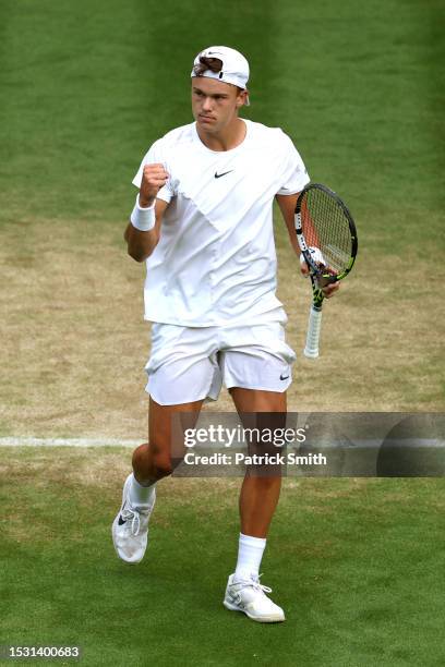 Holger Rune of Denmark celebrates against Grigor Dimitrov of Bulgaria in the Men's Singles fourth round match during day eight of The Championships...