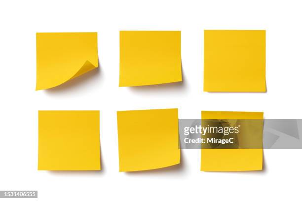 a set of blank yellow adhesive notes isolated on white - post it foto e immagini stock