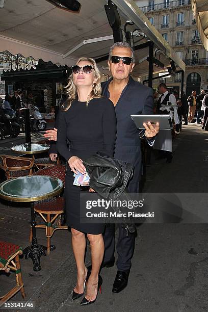 Model Kate Moss and photographer Mario Testino arrive at 'Cafe de Flore' on October 1, 2012 in Paris, France.