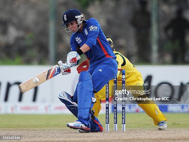 Sarah Taylor of England bats as wicketkeeper Jodie Fields of Australia watches from the stumps during the ICC Women's World Twenty20 2012 Group A...