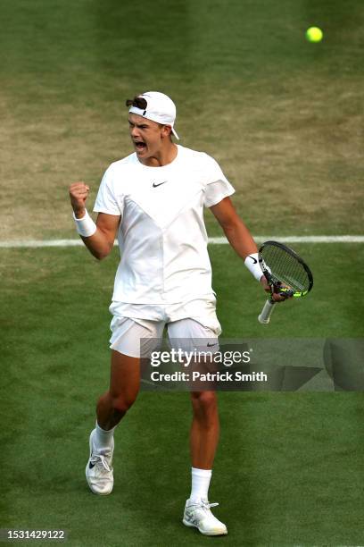 Holger Rune of Denmark celebrates against Grigor Dimitrov of Bulgaria in the Men's Singles fourth round match during day eight of The Championships...