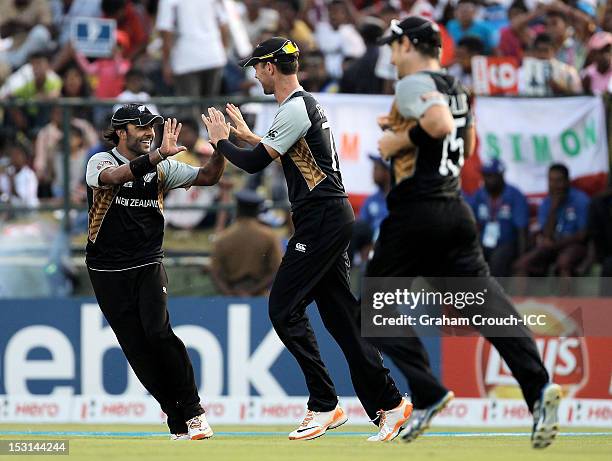 Roneel Hira and James Franklin of New Zealand celebrate a wicket during the Super Eights Group 1 match between New Zealand and West Indies at...