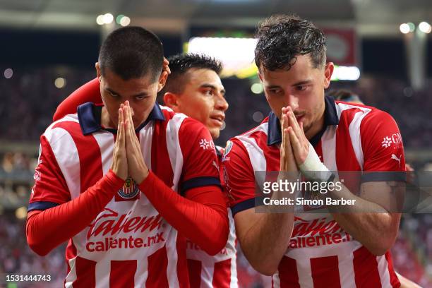 Jesus Brigido of Chivas celebrates with Alan Mozo after scoring the team's second goal during the 3rd round match between Chivas and Necaxa as part...