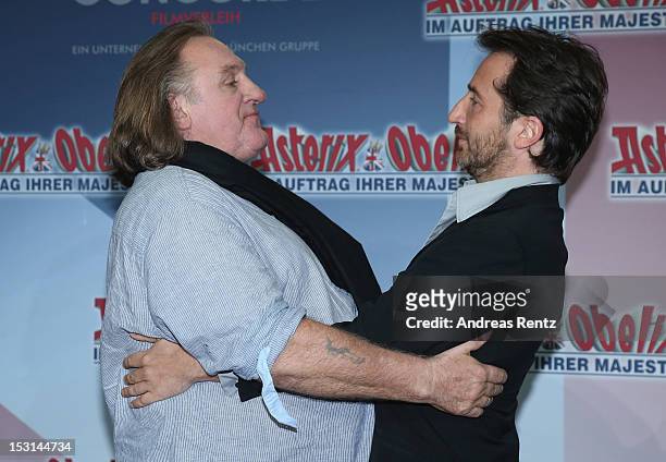 Gerard Depardieu and Edouard Baer attend the 'Asterix & Obelix - God Save Britannia' photocall at Hotel de Rome on October 1, 2012 in Berlin, Germany.