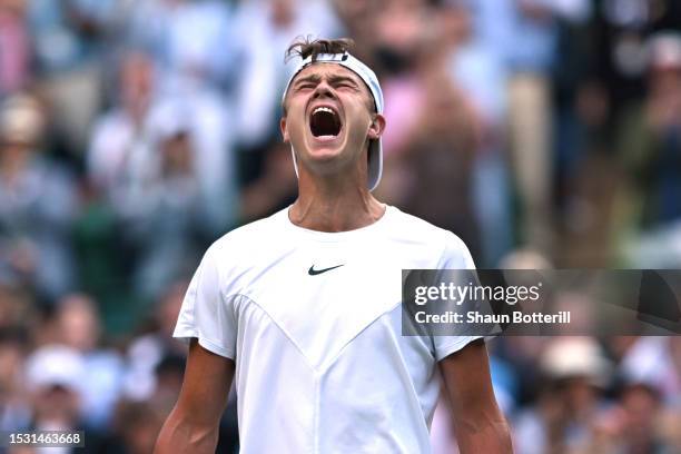Holger Rune of Denmark celebrates winning match point against Grigor Dimitrov of Bulgaria in the Men's Singles fourth round match during day eight of...