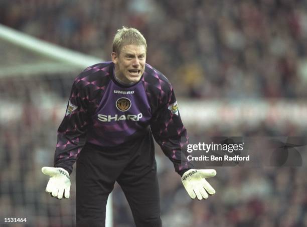 Peter Schmeichel of Manchester United pleads to his teammates during the FA cup fourth round tie between Manchester United and Wimbledon at Old...