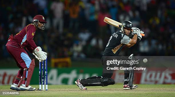 New Zealand captain Ross Taylor bats watched by West Indies wicketkeeper Denesh Ramdin during the ICC World Twenty20 2012 Super Eights Group 1 match...