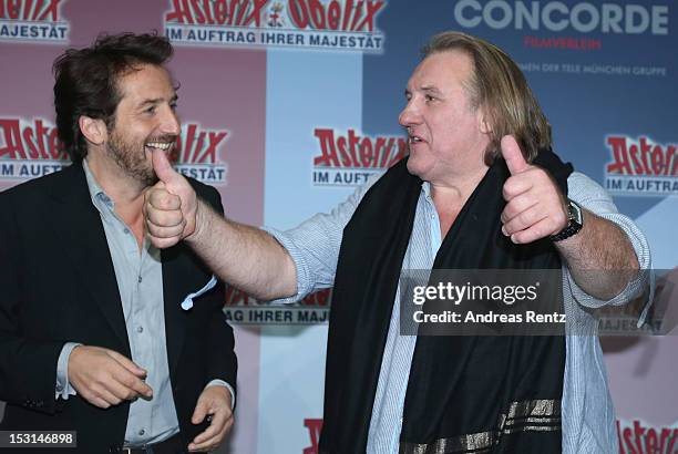 Edouard Baer and Gerard Depardieu attend the 'Asterix & Obelix - God Save Britannia' photocall at Hotel de Rome on October 1, 2012 in Berlin, Germany.