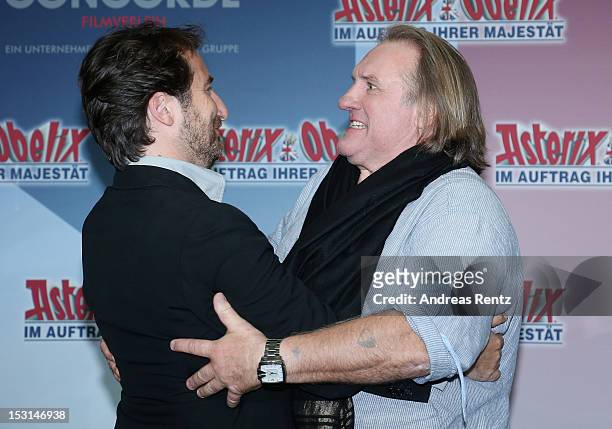 Edouard Baer and Gerard Depardieu attend the 'Asterix & Obelix - God Save Britannia' photocall at Hotel de Rome on October 1, 2012 in Berlin, Germany.