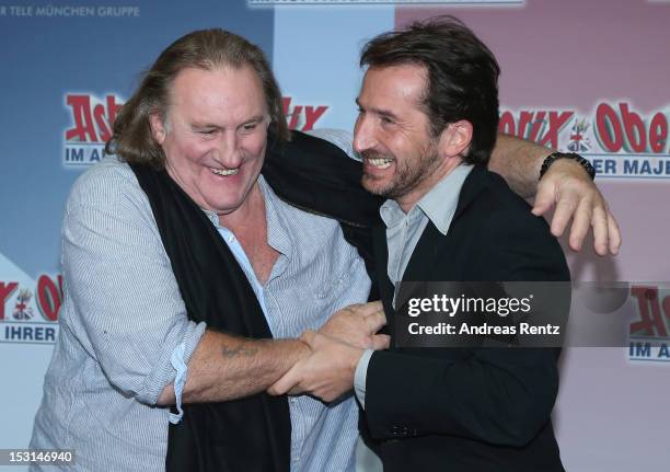 Gerard Depardieu and Edouard Baer attend the 'Asterix & Obelix - God Save Britannia' photocall at Hotel de Rome on October 1, 2012 in Berlin, Germany.