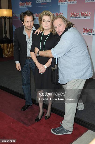 Edouard Baer, Catherine Deneuve and Gerard Depardieu attend the 'Asterix & Obelix - God Save Britannia' Photocall at Hote de Rome on October 1, 2012...
