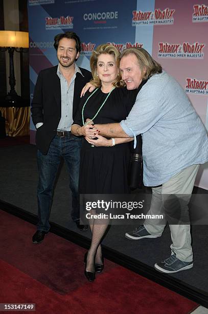 Edouard Baer, Catherine Deneuve and Gerard Depardieu attend the 'Asterix & Obelix - God Save Britannia' Photocall at Hote de Rome on October 1, 2012...