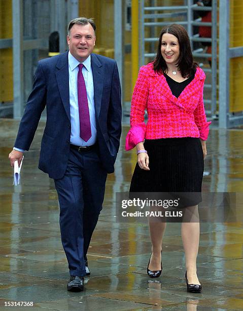 British Shadow Chancellor Ed Balls arrives with Rachel Reeves Shadow Chief Secretary to the Treasury on the second day of the annual Labour Party...