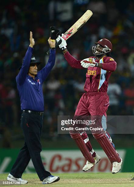 Chris Gayle of the West Indies celebrates winning the superover to win the ICC World Twenty20 2012 Super Eights Group 1 match between the West Indies...