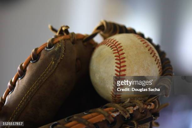 baseball mitt catching the ball - softball sport stock pictures, royalty-free photos & images