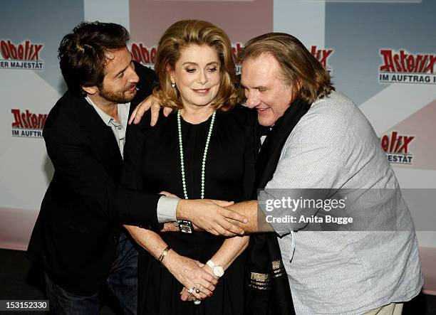 French actors Edouard Baer , Catherine Deneuve and Gerard Depardieu attend the "Asterix & Obelix God Save Britannia" photocall at Hotel de Rome on...