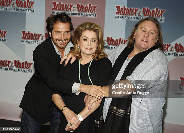 French actors Edouard Baer , Catherine Deneuve and Gerard Depardieu attend the "Asterix & Obelix God Save Britannia" photocall at Hotel de Rome on...