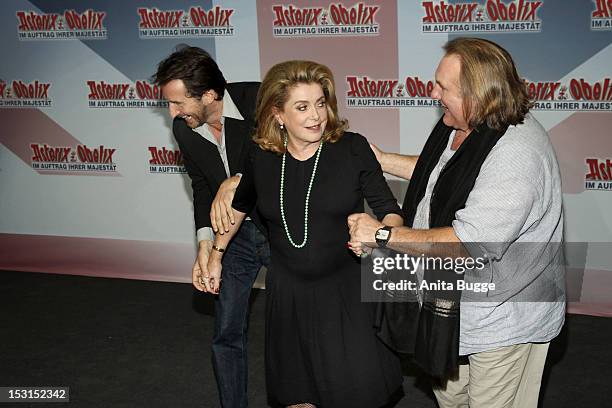 French actors Edouard Baer , Catherine Deneuve and Gerard Depardieu attend the "Asterix & Obelix God Save Britannia" photocall at Hotel de Rome on...